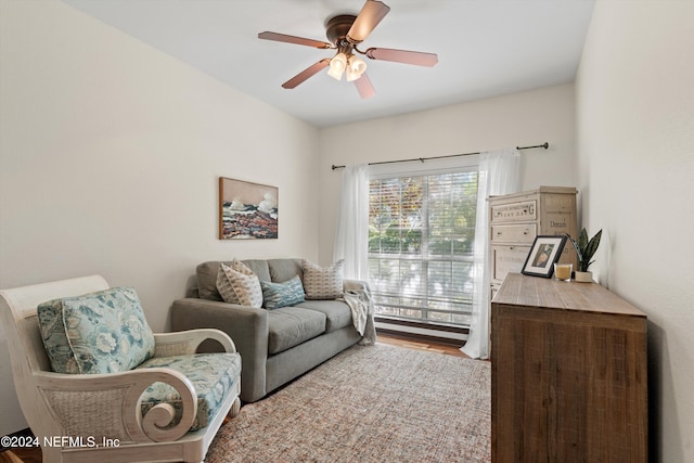 living room with hardwood / wood-style flooring and ceiling fan