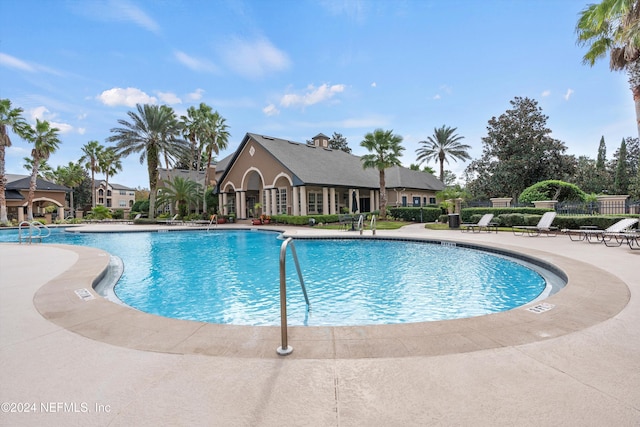 view of pool featuring a patio area