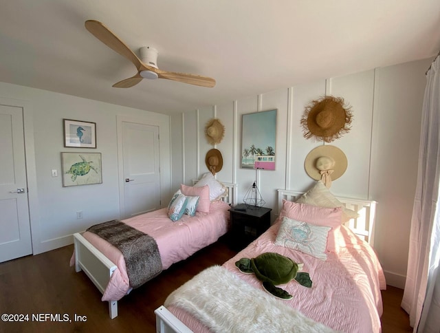 bedroom featuring dark hardwood / wood-style flooring and ceiling fan