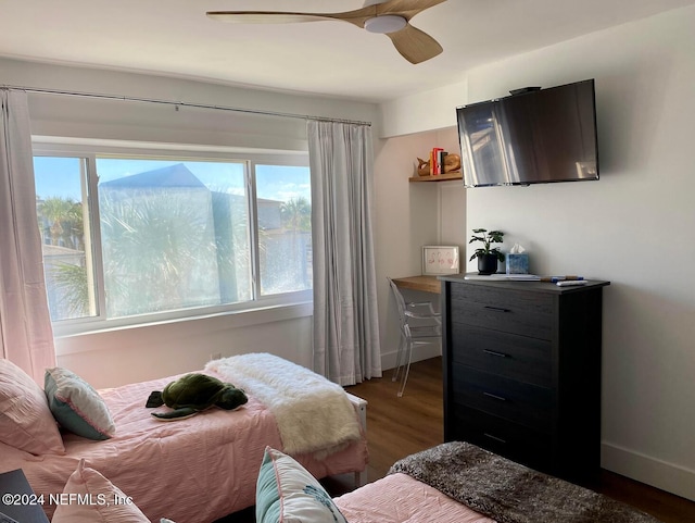 bedroom featuring ceiling fan and dark wood-type flooring