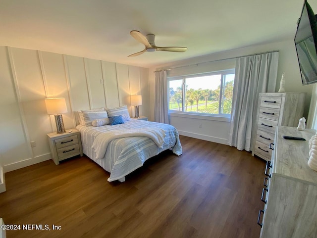 bedroom with ceiling fan and dark wood-type flooring