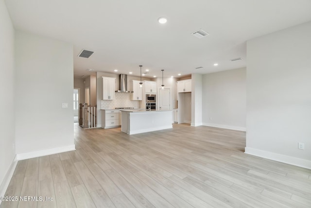 10266 Element Rd, Jacksonville, FL 32256 - unfurnished living room featuring light wood-type flooring, baseboards, and recessed lighting