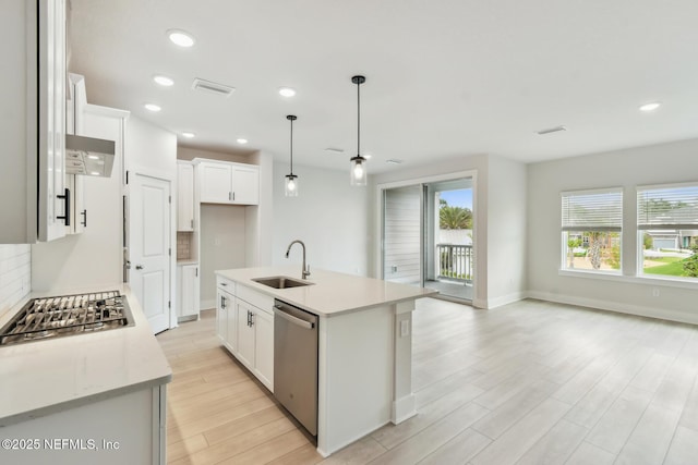 10266 Element Rd, Jacksonville, FL 32256 - kitchen featuring a sink, appliances with stainless steel finishes, light wood-type flooring, healthy amount of natural light, and recessed lighting