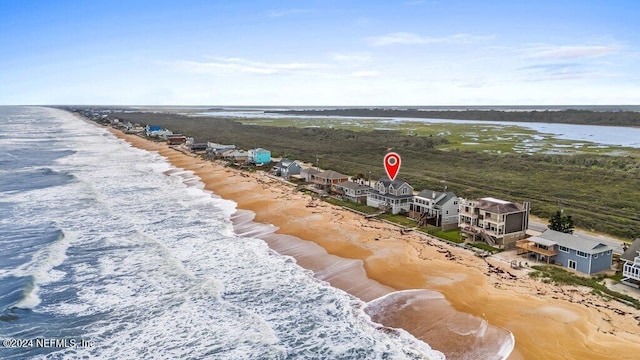 aerial view featuring a water view and a view of the beach