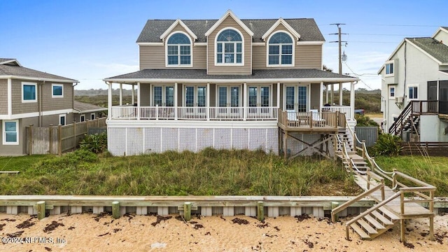 back of house featuring a porch