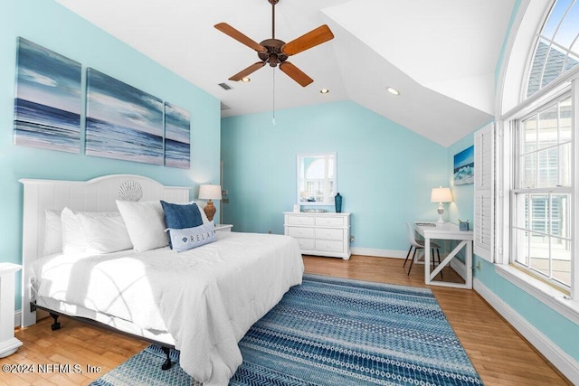 bedroom with hardwood / wood-style floors, ceiling fan, and lofted ceiling