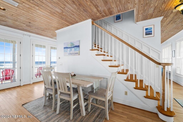 dining room featuring wood ceiling, french doors, and wood-type flooring