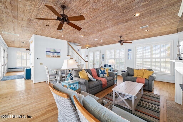 living room featuring a healthy amount of sunlight, wooden ceiling, and light hardwood / wood-style flooring