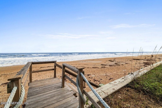 view of community with a view of the beach and a water view