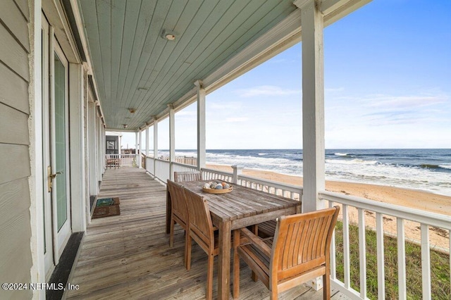 exterior space with a water view and a view of the beach