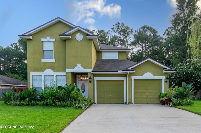 front facade with a front yard and a garage