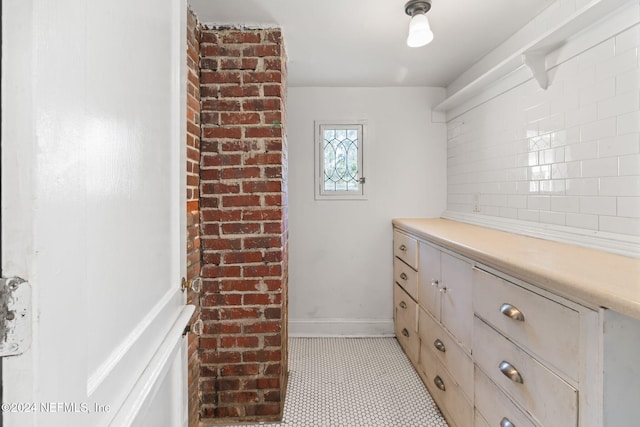 spacious closet featuring light tile patterned floors