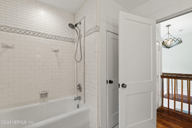 bathroom with wood finished floors and shower / bathing tub combination