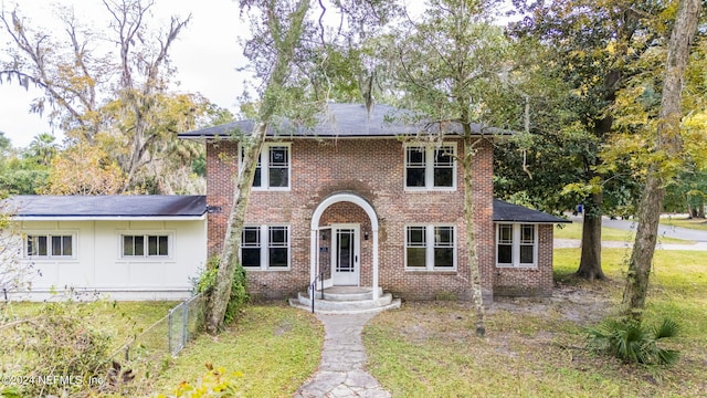 colonial house with brick siding