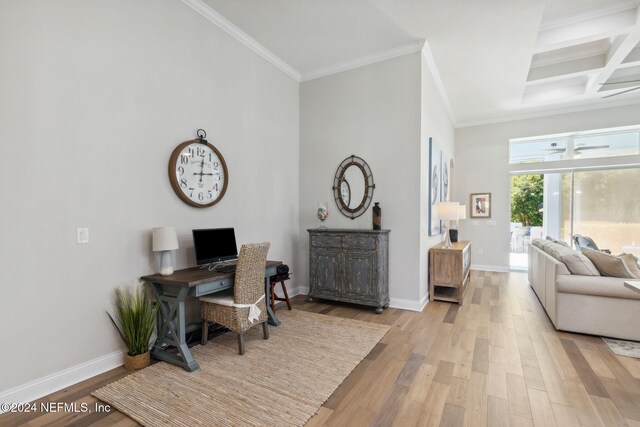 office space featuring ornamental molding, beamed ceiling, coffered ceiling, and light hardwood / wood-style flooring