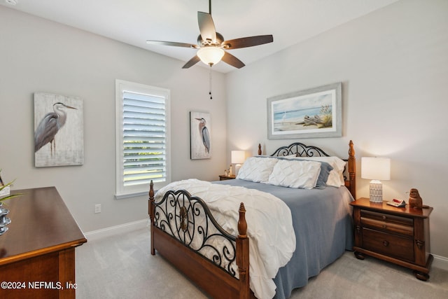 bedroom featuring ceiling fan and light colored carpet