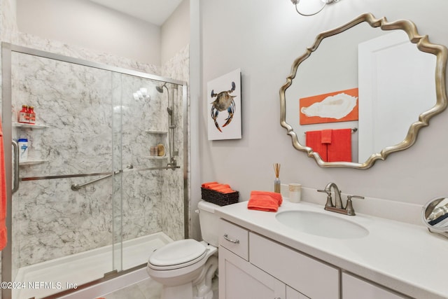 bathroom featuring vanity, tile patterned flooring, toilet, and an enclosed shower