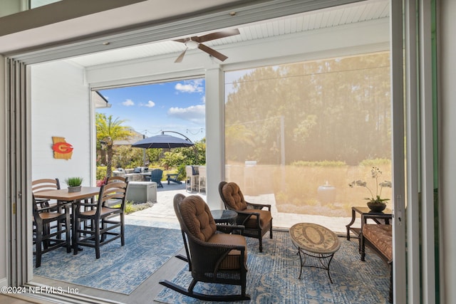 interior space with ceiling fan