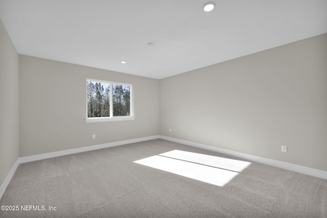 empty room with carpet flooring