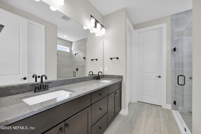 bathroom featuring vanity and walk in shower