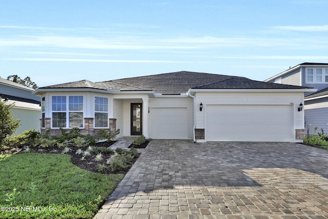 prairie-style house featuring a garage