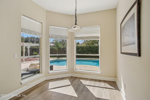 unfurnished dining area with hardwood / wood-style flooring