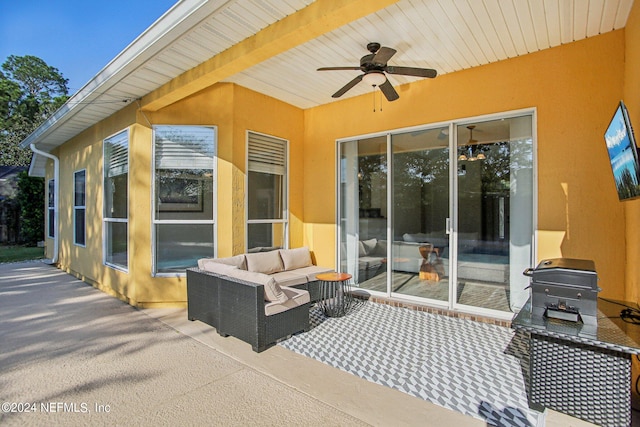 view of patio featuring area for grilling and ceiling fan