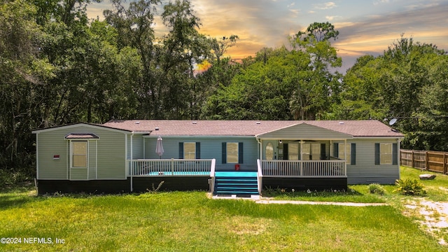 view of front of home featuring a lawn