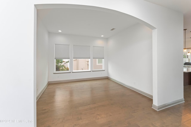 unfurnished living room with hardwood / wood-style floors