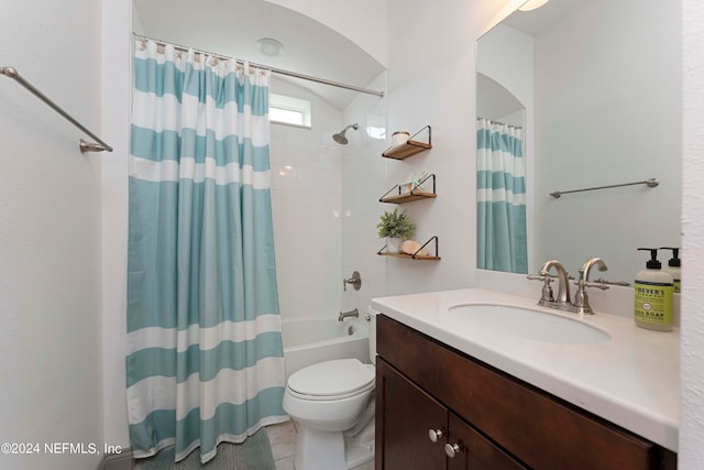 full bathroom featuring shower / bath combo, vanity, and toilet