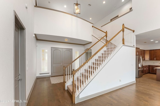 stairs with hardwood / wood-style flooring