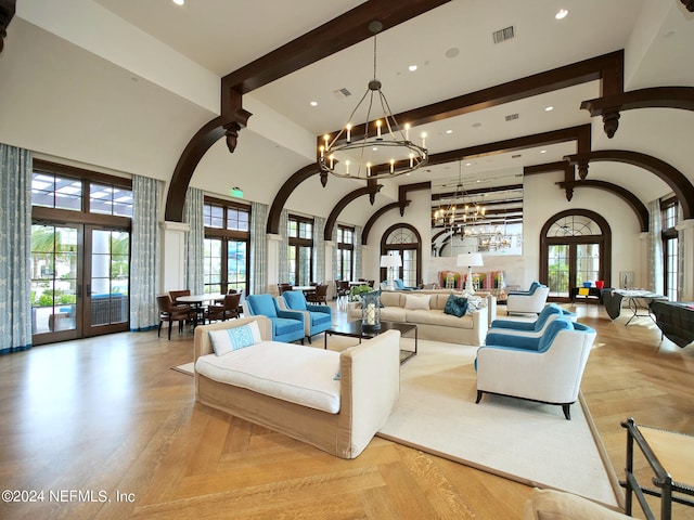 living room featuring french doors, a high ceiling, beam ceiling, and a chandelier