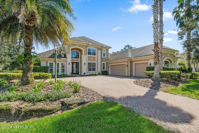 mediterranean / spanish house featuring a garage