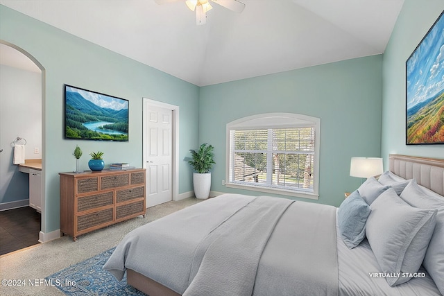 bedroom with lofted ceiling, carpet flooring, and ceiling fan