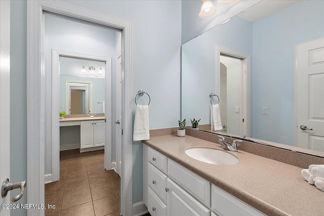 bathroom with vanity and tile patterned floors