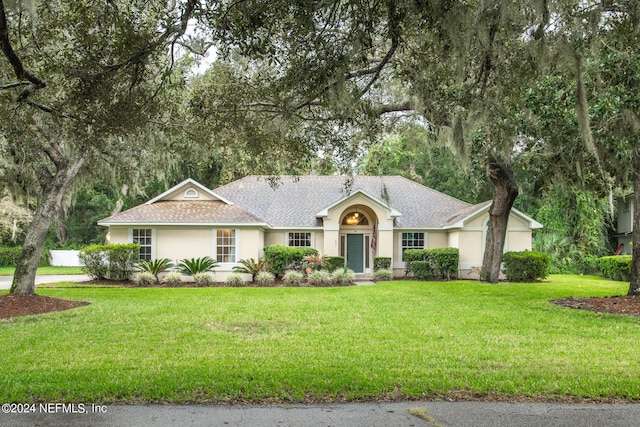 single story home with a front yard