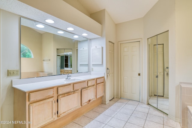 bathroom with vanity, tile patterned flooring, and a textured ceiling