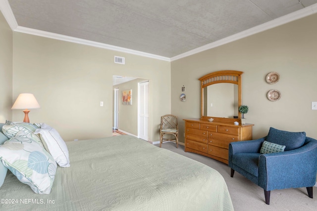 carpeted bedroom featuring crown molding and a textured ceiling