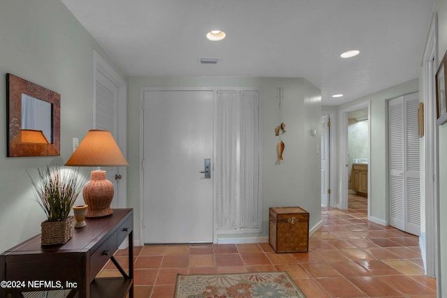 foyer featuring light tile patterned floors