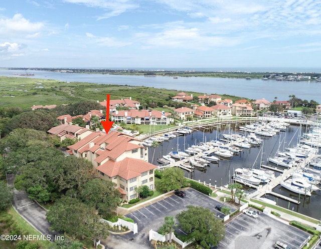 birds eye view of property featuring a water view