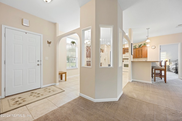 view of carpeted foyer entrance