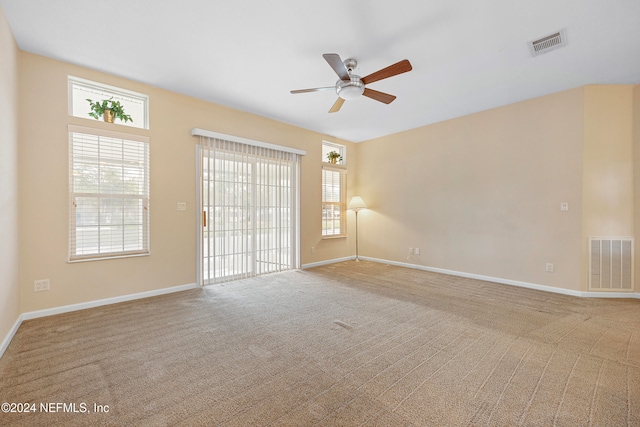 empty room featuring carpet floors and ceiling fan