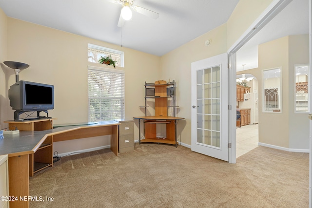 home office with light carpet and ceiling fan