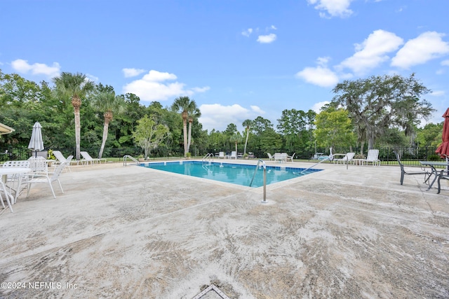 view of pool featuring a patio