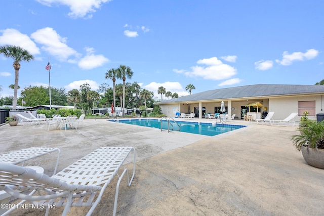 view of swimming pool with a patio area