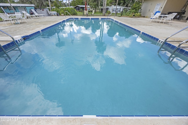 view of swimming pool featuring a patio