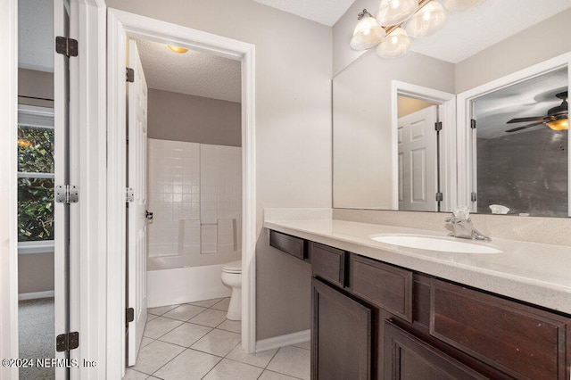 full bathroom featuring toilet, a textured ceiling, tile patterned flooring, bathing tub / shower combination, and vanity