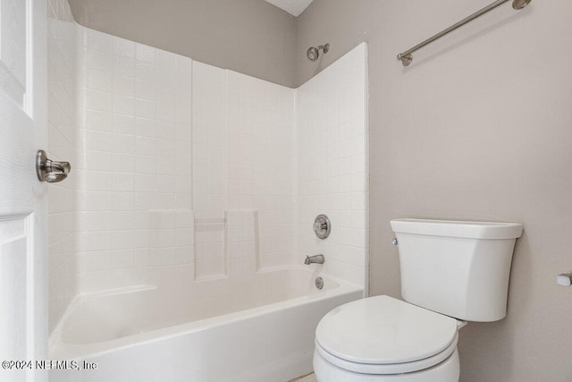 bathroom featuring toilet and shower / bathtub combination