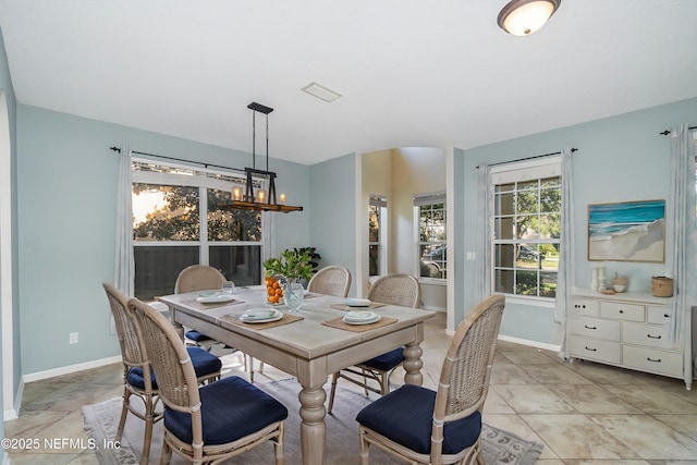 dining space with light tile patterned flooring