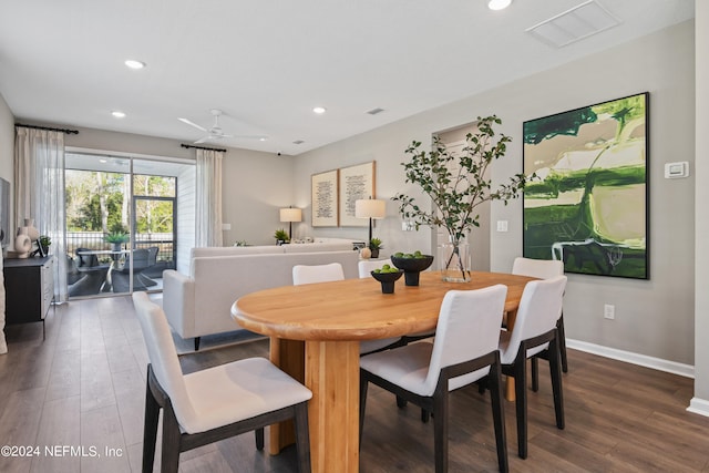 dining area featuring wood-type flooring and ceiling fan